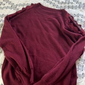 Tunic length sweater.